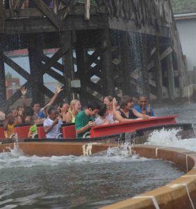 People getting soaked on a log flume.