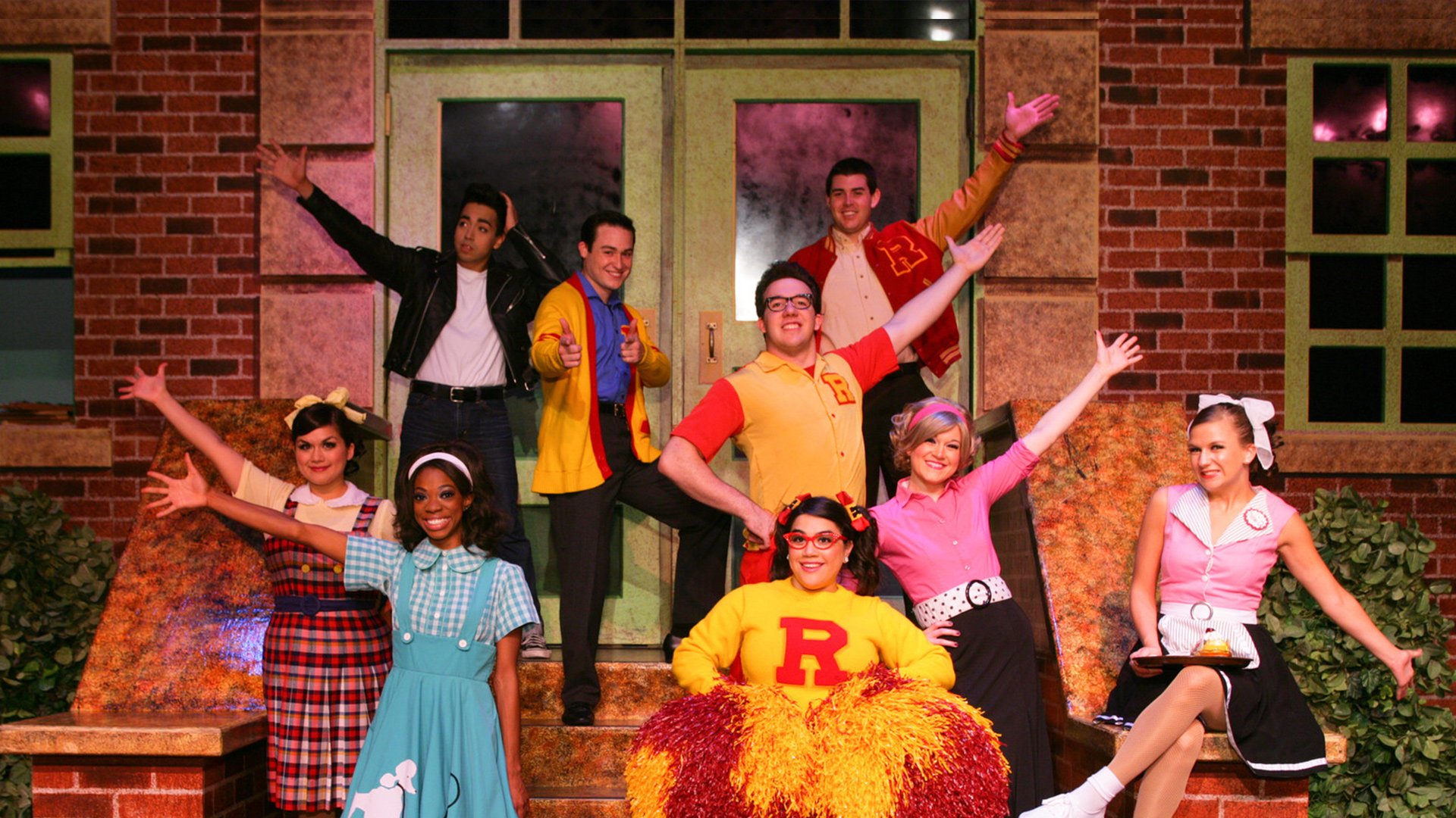 Entertainers performing in a live musical production at Six Flags theme park