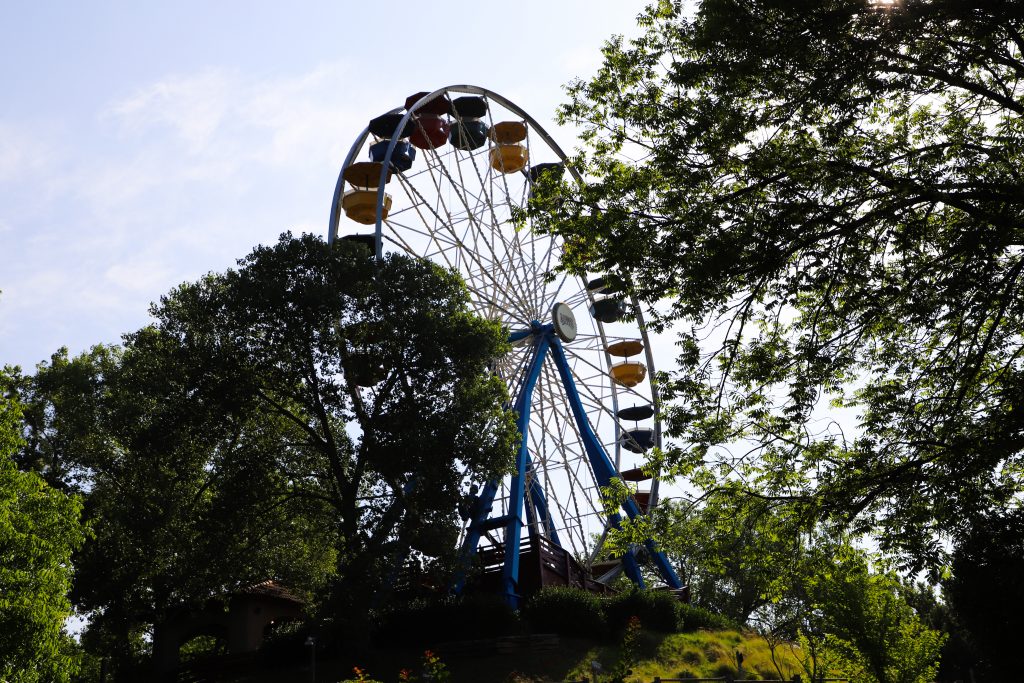 Grand Centennial Ferris Wheel spinning during the day