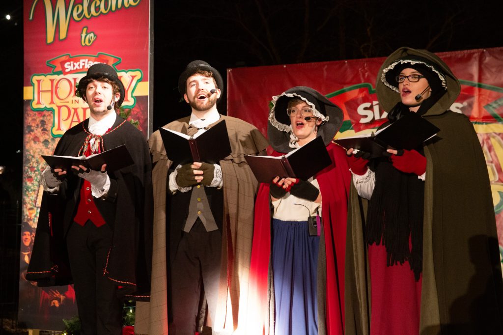Carolers singing on stage.