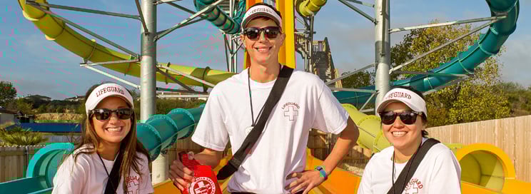 Lifeguards in front of a slide