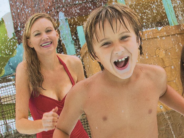 Mother and Son Playing at Waterpark
