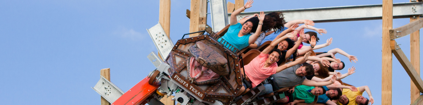 Guests riding the Iron Rattler at Six Flags Fiesta Texas