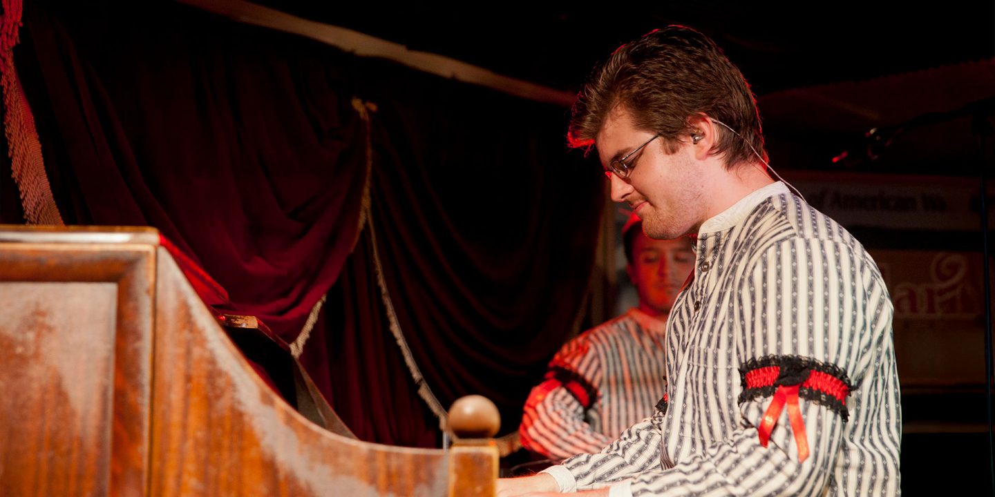 a performer playing piano