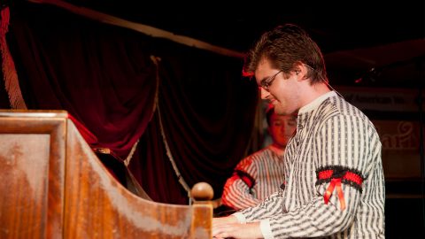 a performer playing piano