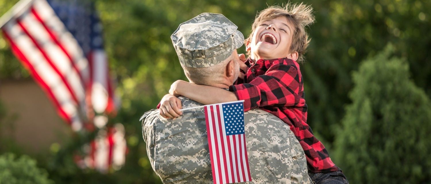 Six Flags Discovery Kingdom Military - Child Hugging His Dad In Military Uniform Resized 1 1 