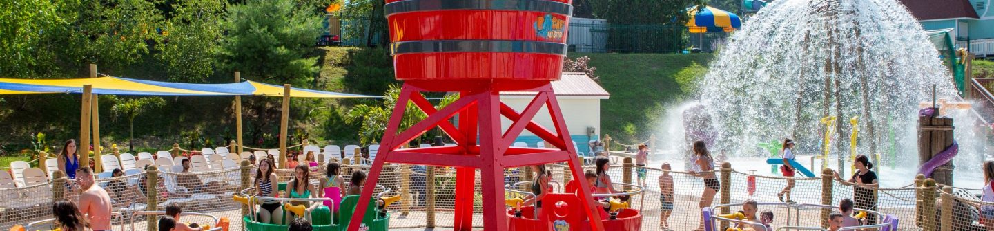 bucketblasters People playing in a water park tea cup ride.