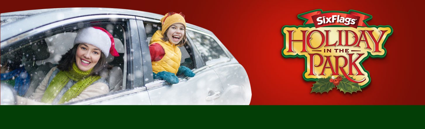 Mom and daughter smiling in winter coats in the car